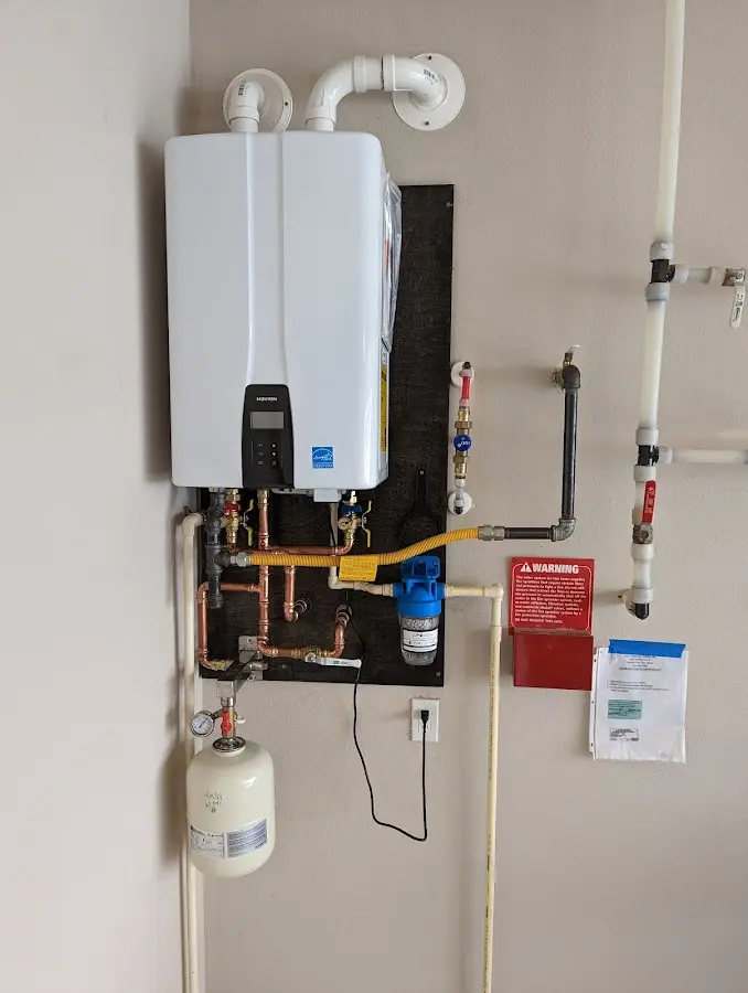 Professional plumber installing copper piping in a Fort Worth home